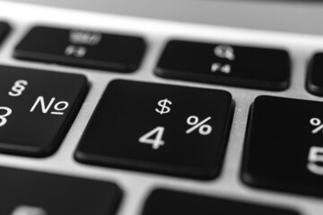Dollars key and button on keyboard. Dollar sign close-up. Modern laptop, communication concept photo