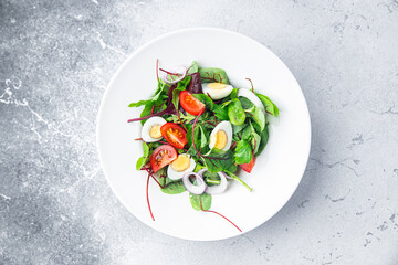 salad quail egg tomato mix leaves vegetable healthy meal food snack on the table copy space food background keto or paleo diet veggie vegan or vegetarian food