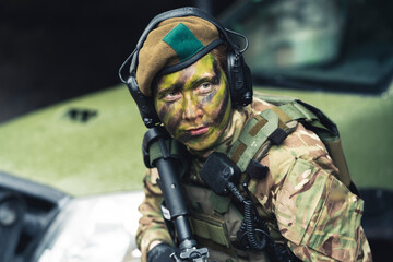 Vicious feminine armed fighter with rageful eyes . High quality photo