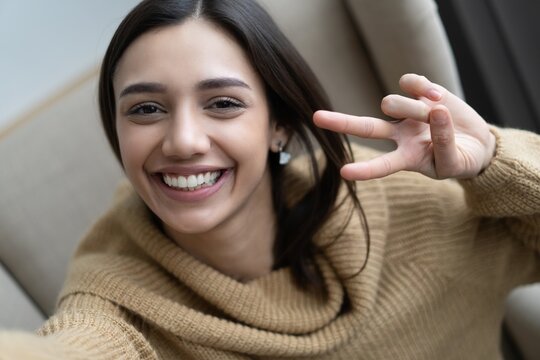 Image Closeup Of Stylish Woman 20s Smiling While Looking At Camera And Taking Selfie Photo In Living Room.