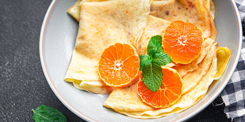 sweet crepe citrus thin pancake breakfast Shrovetide holiday Maslenitsa dessert pancakes meal food snack on the table copy space food background