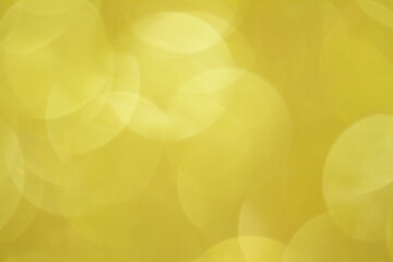 Abstract yellow background. Defocused lights with bokeh. Spring, Summer, Christmas, New Year. Copy space