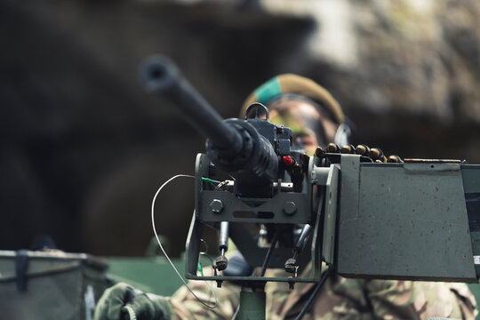 Frightening gun barrel machine firing mode closeup. High quality photo