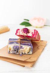 Handmade natural soap with rose and lavender on wooden background