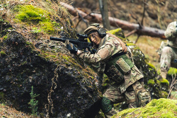 Machismo feminine sergeant leading British task force aiming to attack . High quality photo - obrazy, fototapety, plakaty