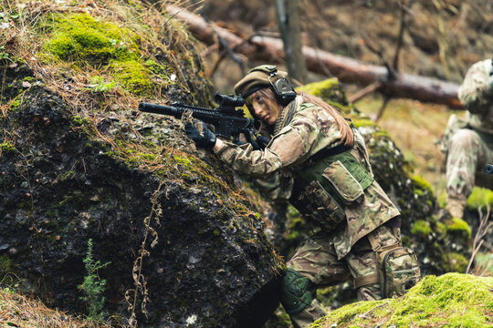 Machismo feminine sergeant leading British task force aiming to attack . High quality photo