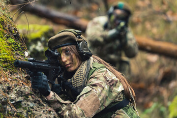 Fototapeta premium Resilient colonel tough women heroes aiming to protect