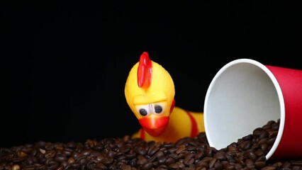 footage of coffee cup rubber chicken dark background