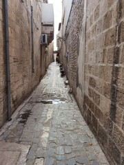 Fototapeta na wymiar Narrow old town streets of Sanliurfa so narrow that only pedestrians can go through no mounts
