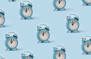 Blue alarm clock pattern on a blue background. 