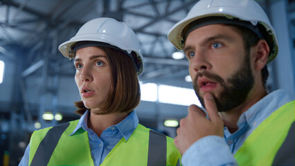 Portrait factory supervisors discussing supply production shipment process