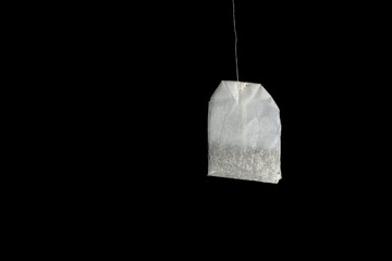 Tea bag isolated on black background. High resolution.