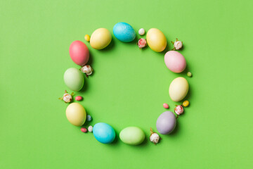 round frame Multi colors Easter eggs on colored background . Pastel color Easter eggs holiday concept with empty space for you design