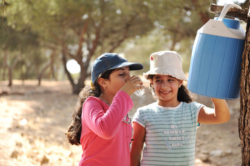 Children having picnic in scout camp in nature