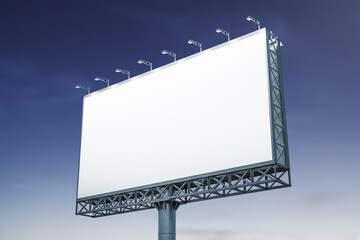 Blank white billboard on blue sky background at evening, perspective view. Mockup, advertising concept