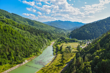 Mountain landscape with river flowing through the valley