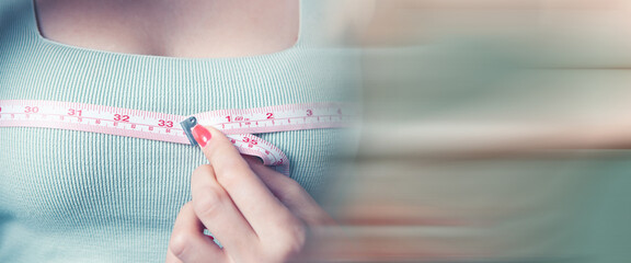 young girl measures her breasts