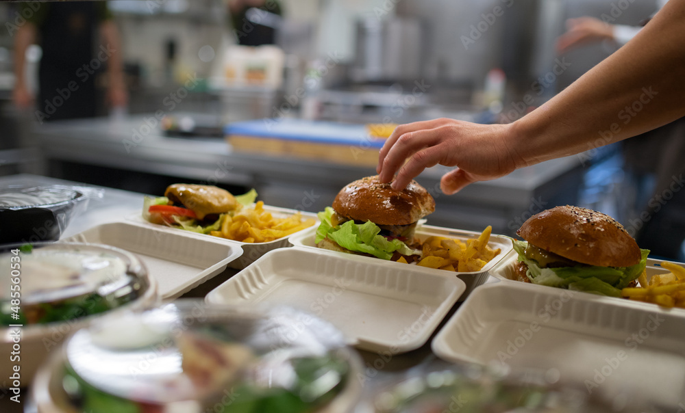 Wall mural meals in containers prepared for take away in kitchen restaurant.