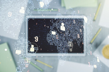 Double exposure of social network icons concept with world map and digital tablet on background, top view. Marketing and promotion concept