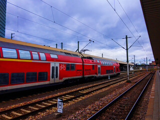 Fototapeta na wymiar Platform, rails, train with locomotives on station