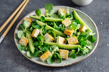 Vegan salad with tofu and cucumbers
