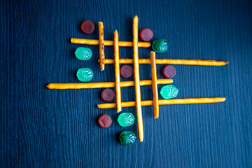 Cracker sticks lattice with mints lollipops and marmalad