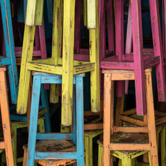 Colorful wooden stools on the bar. 