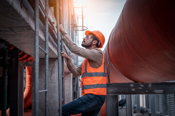 engineer under checking the industry cooling tower air conditioner is water cooling tower air...