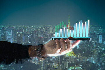 Finance Content marketing concept and Digital marketing with person hand using a smart phone computer on cityscape background..