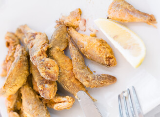 Red mullet, sprat, whole baked on a plate