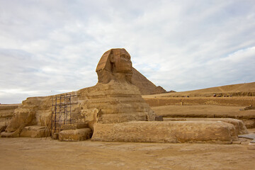 Sphinx, an ancient Egyptian limestone statue of a mythical creature with a lion's body and human...