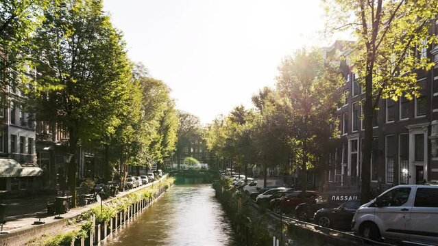 Amsterdam, Netherlands, Timelapse - The Canal during a sunny day 