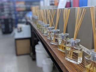 Row of scent reeds on shelf