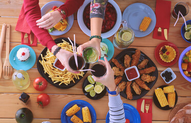 Top view of group of people having dinner together while sitting