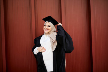 Smiling woman wearing graduation hat