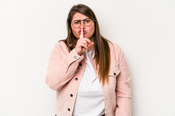 Young caucasian overweight woman isolated on white background keeping a secret or asking for silence.