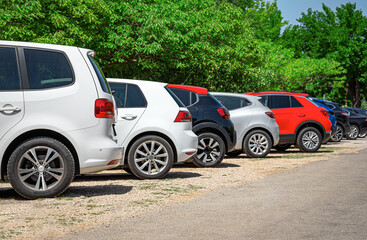 Car parking in open space. Cars in a row.