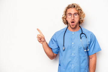 Young nurse caucasian man isolated on white background pointing to the side