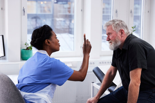 Senior man having eye exam during doctor appointment