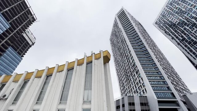 Blending old and new architecture. A city with mixed architecture- sovet union building together whith high modern towers. Low Angle View.