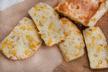 Mielie bread, a South African bread with whole sweetcorn on rustic  kitchen table