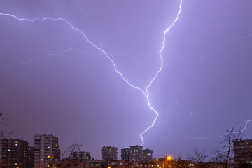 Thunder and Lightning over the city at night sky