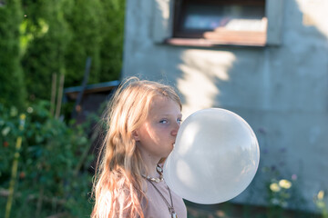 big bubble from chewing gum and child