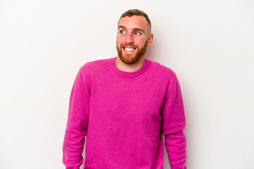 Fototapeta premium Young caucasian man isolated on white background laughs and closes eyes, feels relaxed and happy.