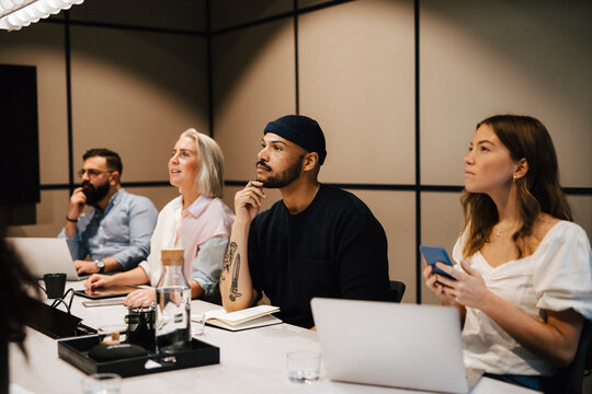 Coworkers having meeting in office