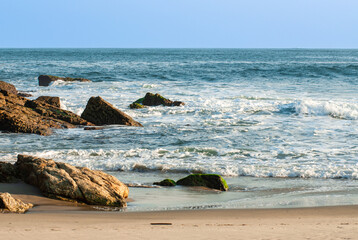 Rocks and Waves on the beach of the north coast of Sao Paulo, Brazil