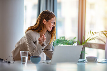 Beautiful clever cute charming attractive elegant owner of big company has online meeting with...
