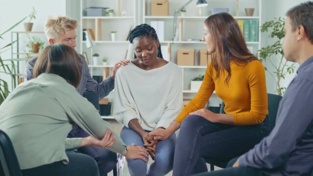 African American Woman Shares Her Personal Addiction Problem, Emotional Pain, Receives Psychological Support, Compassion, Empathy From People in a Group Therapy Session. Abuse, Violence, Depression.