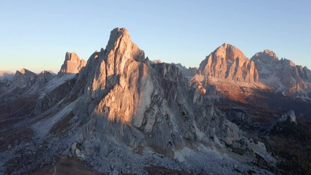 4k drone forward video (Ultra High Definition) of Giau pass road with Ra Gusela peak. Fantastic autumn scene of Dolomite Alps, Belluno province, Italy, Europe. Traveling concept background.
