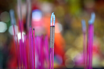 The incense burned out is almost gone, bokeh background.